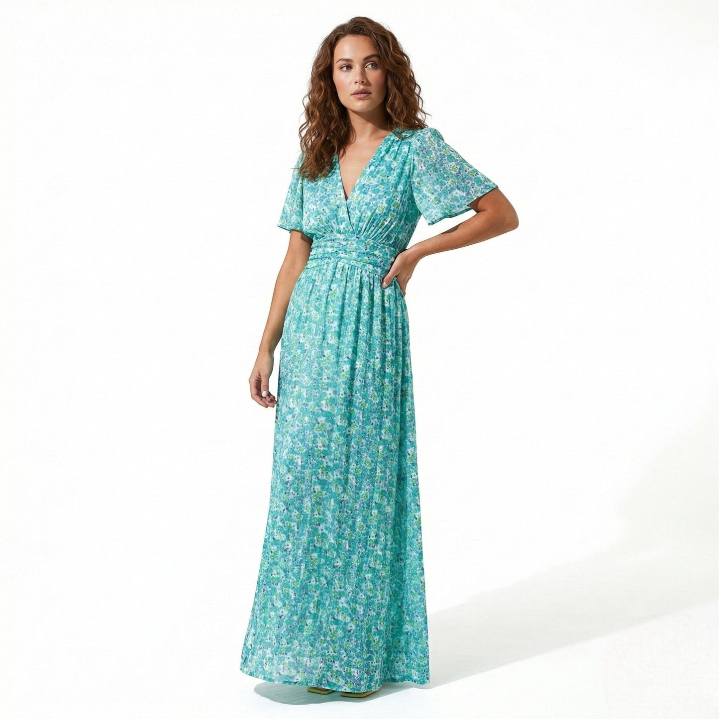 Women's maxi dress with V-neck, floral pattern, and flutter sleeves