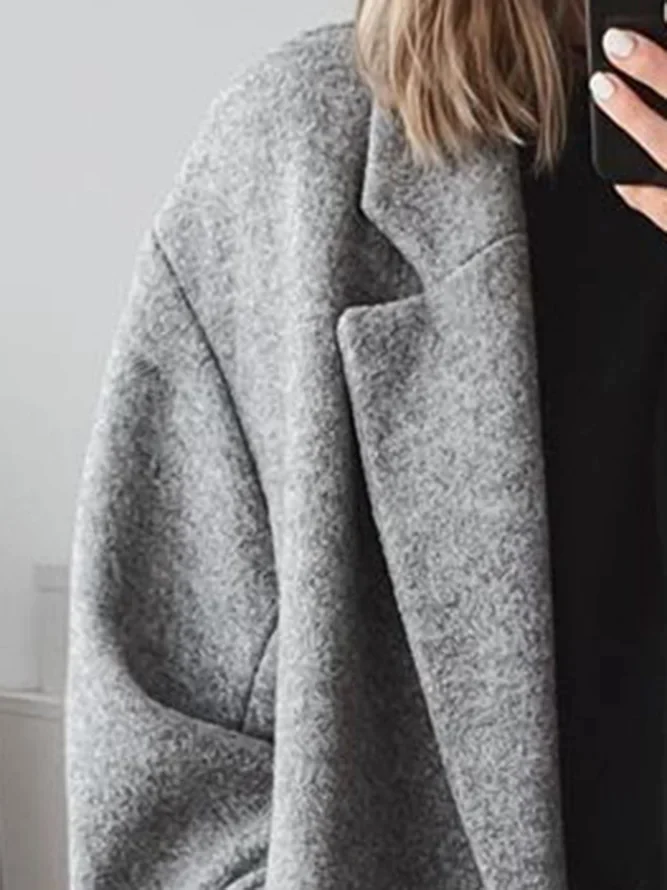 Women's long coat with classic cut and button closure