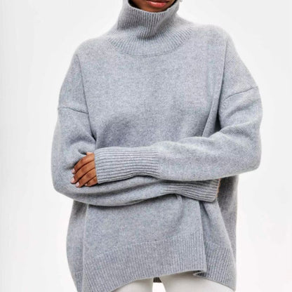 Knitted sweater with high collar and loose fit