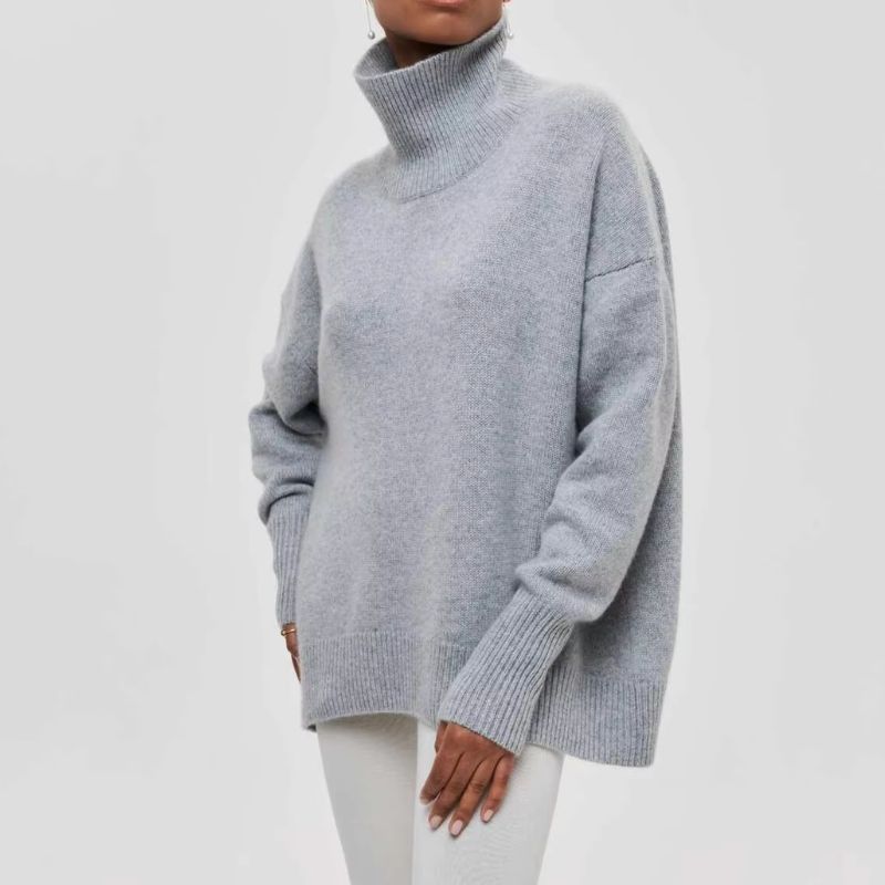 Knitted sweater with high collar and loose fit