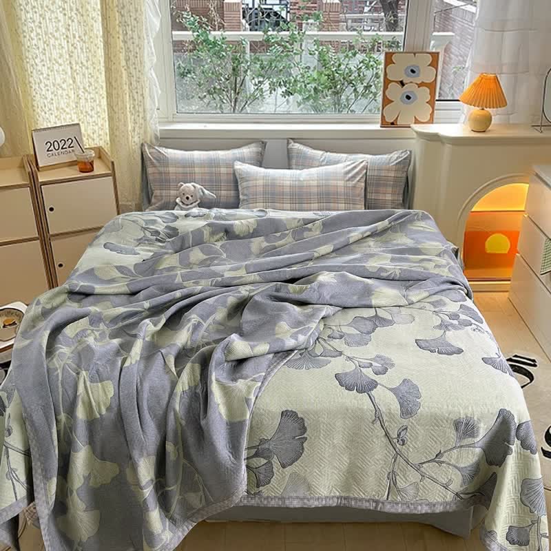 Reversible cotton gauze blanket with ginkgo leaf pattern and border, breathable for summer and transitional seasons