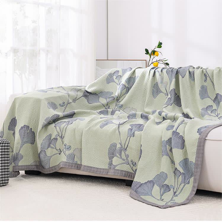Reversible cotton gauze blanket with ginkgo leaf pattern and border, breathable for summer and transitional seasons