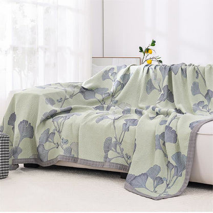 Reversible cotton gauze blanket with ginkgo leaf pattern and border, breathable for summer and transitional seasons