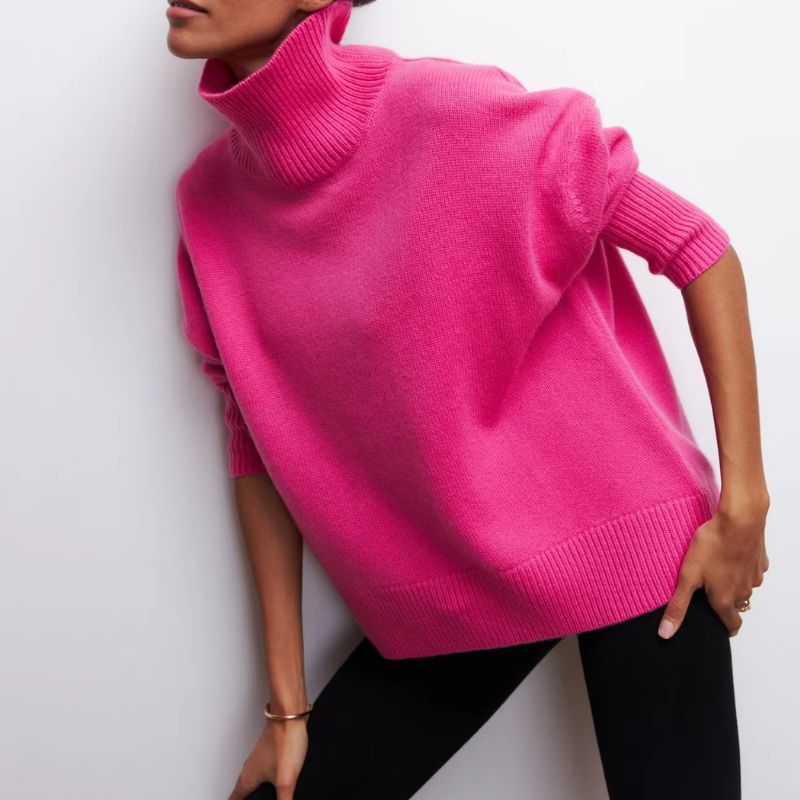 Knitted sweater with high collar and loose fit