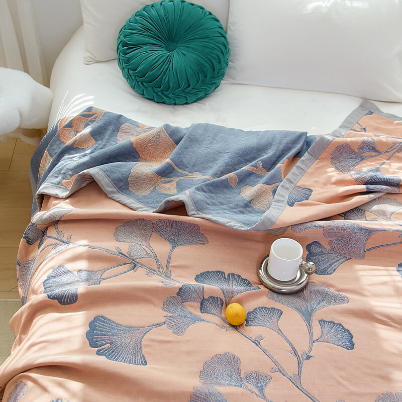 Reversible cotton gauze blanket with ginkgo leaf pattern and border, breathable for summer and transitional seasons
