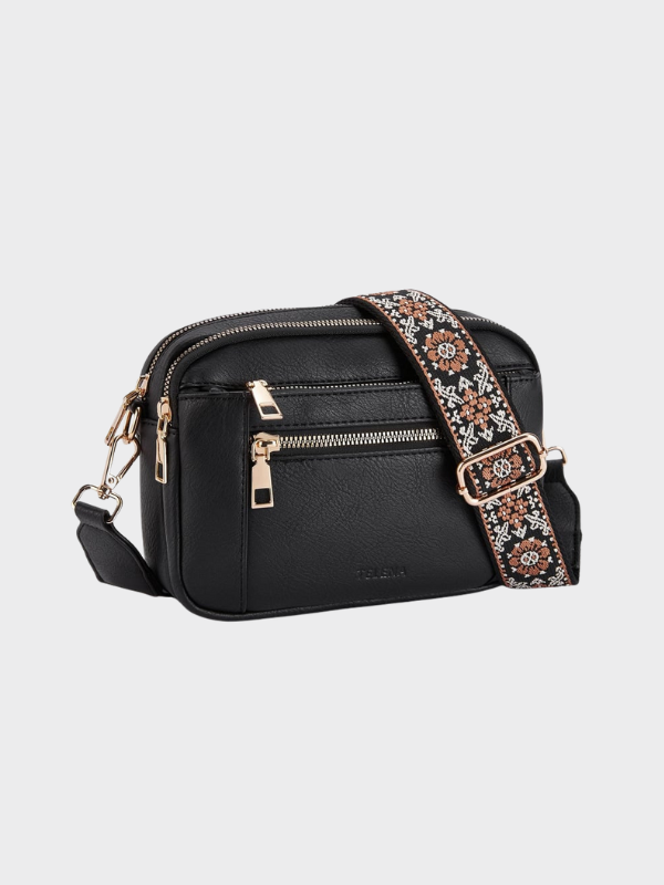 Women's leather shoulder bag with main compartment and adjustable strap