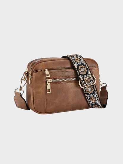 Women's leather shoulder bag with main compartment and adjustable strap