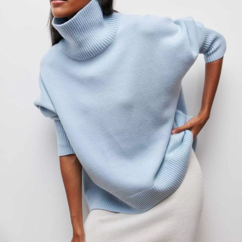Knitted sweater with high collar and loose fit
