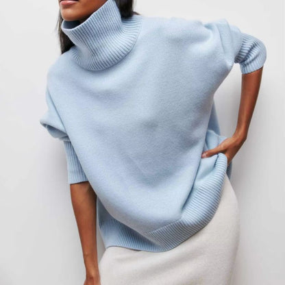 Knitted sweater with high collar and loose fit
