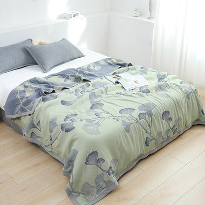 Reversible cotton gauze blanket with ginkgo leaf pattern and border, breathable for summer and transitional seasons