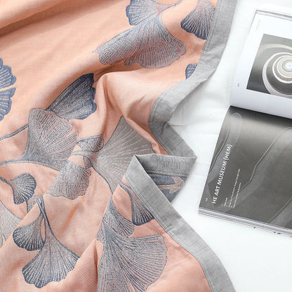 Reversible cotton gauze blanket with ginkgo leaf pattern and border, breathable for summer and transitional seasons