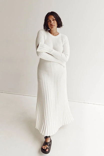 Floor-length women's maxi dress with vertical lines and slim silhouette