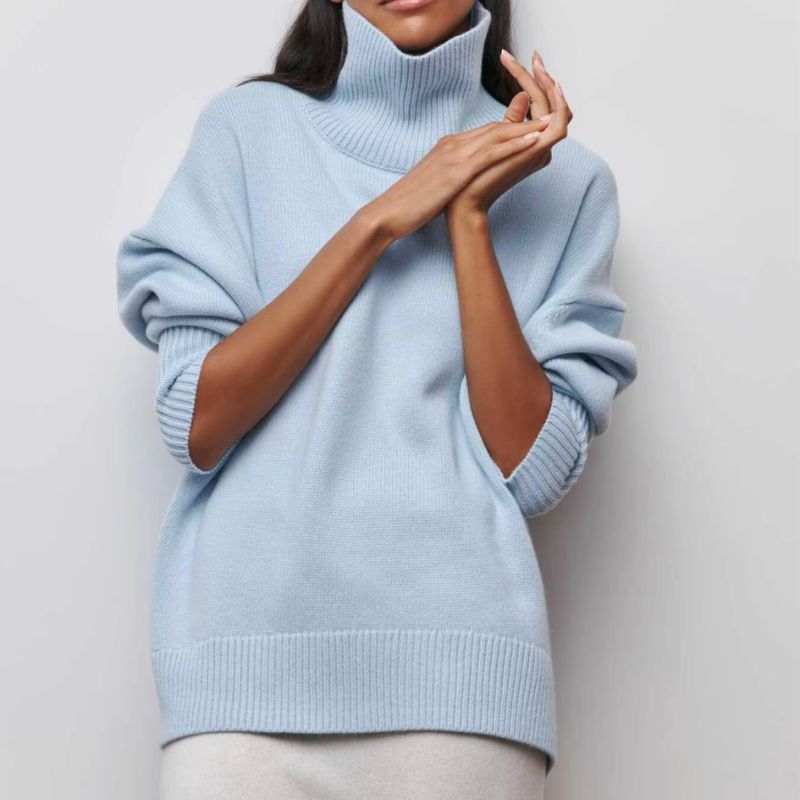 Knitted sweater with high collar and loose fit