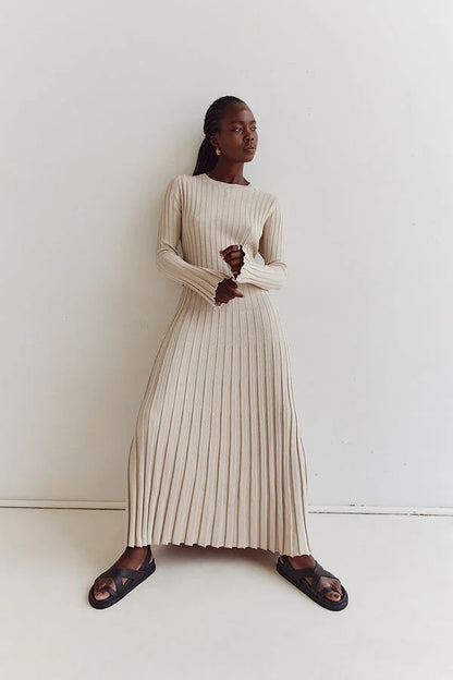 Floor-length women's maxi dress with vertical lines and slim silhouette
