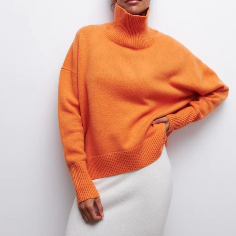 Knitted sweater with high collar and loose fit