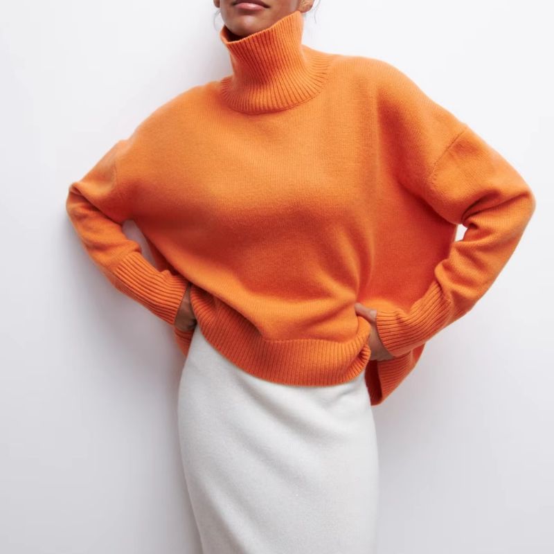 Knitted sweater with high collar and loose fit