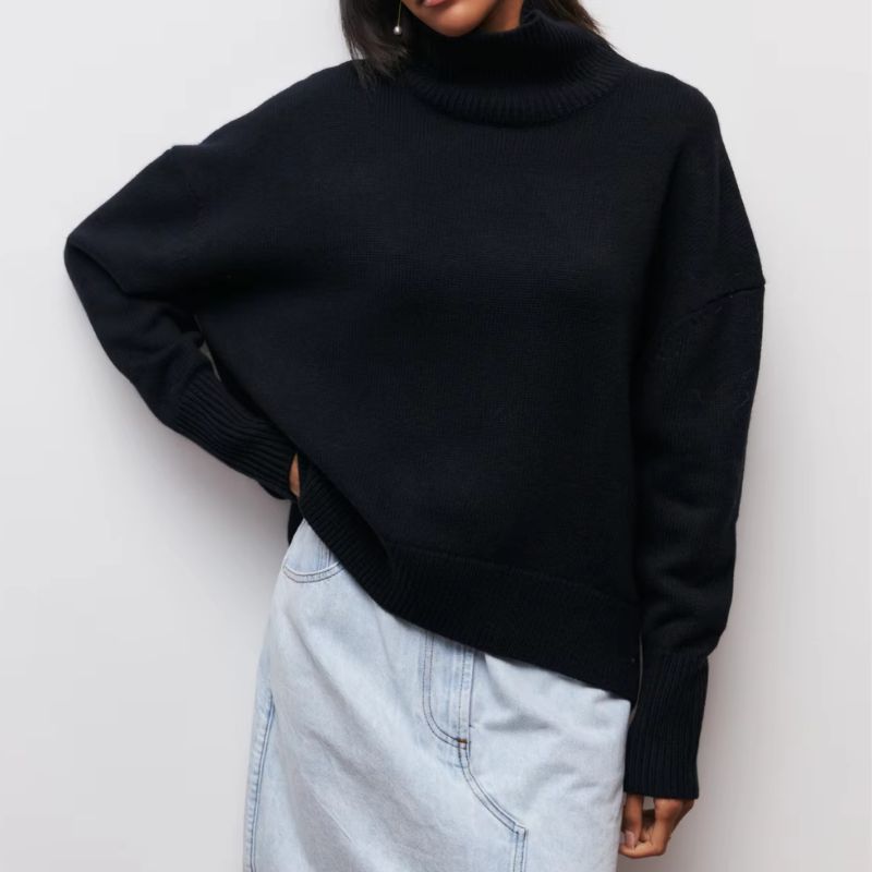 Knitted sweater with high collar and loose fit