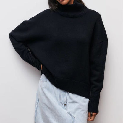 Knitted sweater with high collar and loose fit