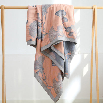 Reversible cotton gauze blanket with ginkgo leaf pattern and border, breathable for summer and transitional seasons