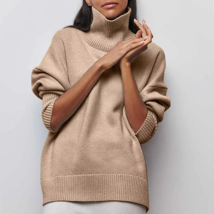 Knitted sweater with high collar and loose fit
