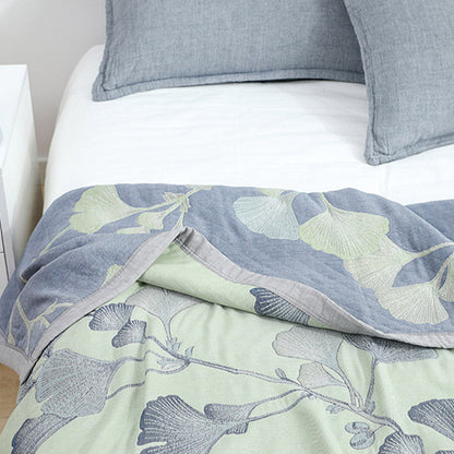 Reversible cotton gauze blanket with ginkgo leaf pattern and border, breathable for summer and transitional seasons