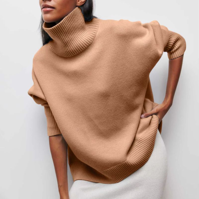 Knitted sweater with high collar and loose fit
