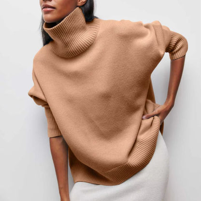 Knitted sweater with high collar and loose fit