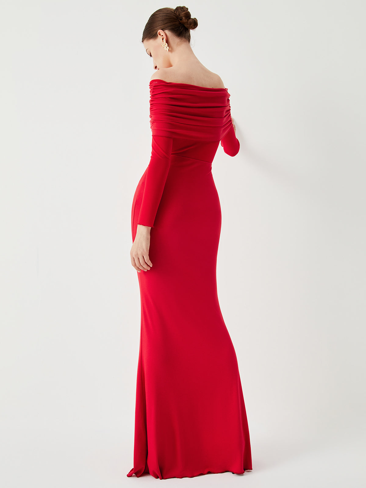 Floor-length women's evening dress with off-the-shoulder neckline, long sleeves, and gathered bust