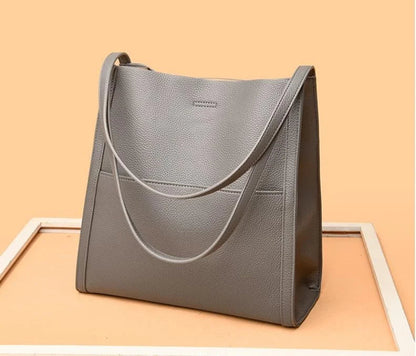 Women's leather handbag with multiple compartments