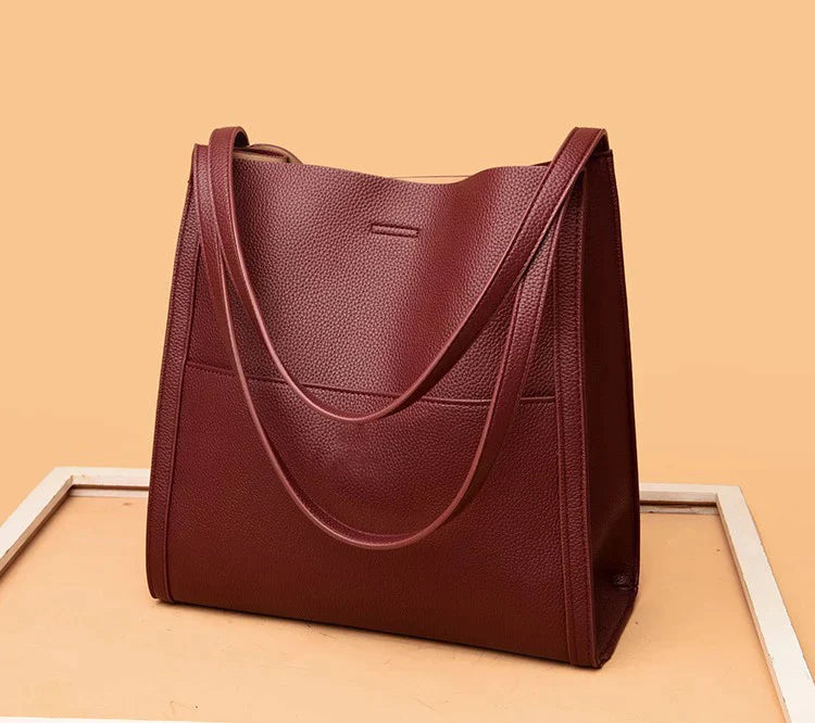 Women's leather handbag with multiple compartments