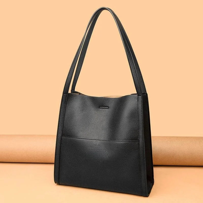 Women's leather handbag with multiple compartments