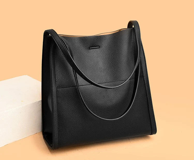Women's leather handbag with multiple compartments