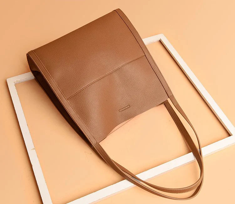 Women's leather handbag with multiple compartments