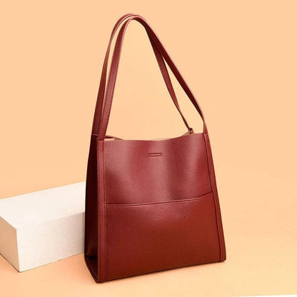 Women's leather handbag with multiple compartments
