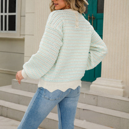 Women's knit pullover made of cotton blend with striped pattern and button placket at the back