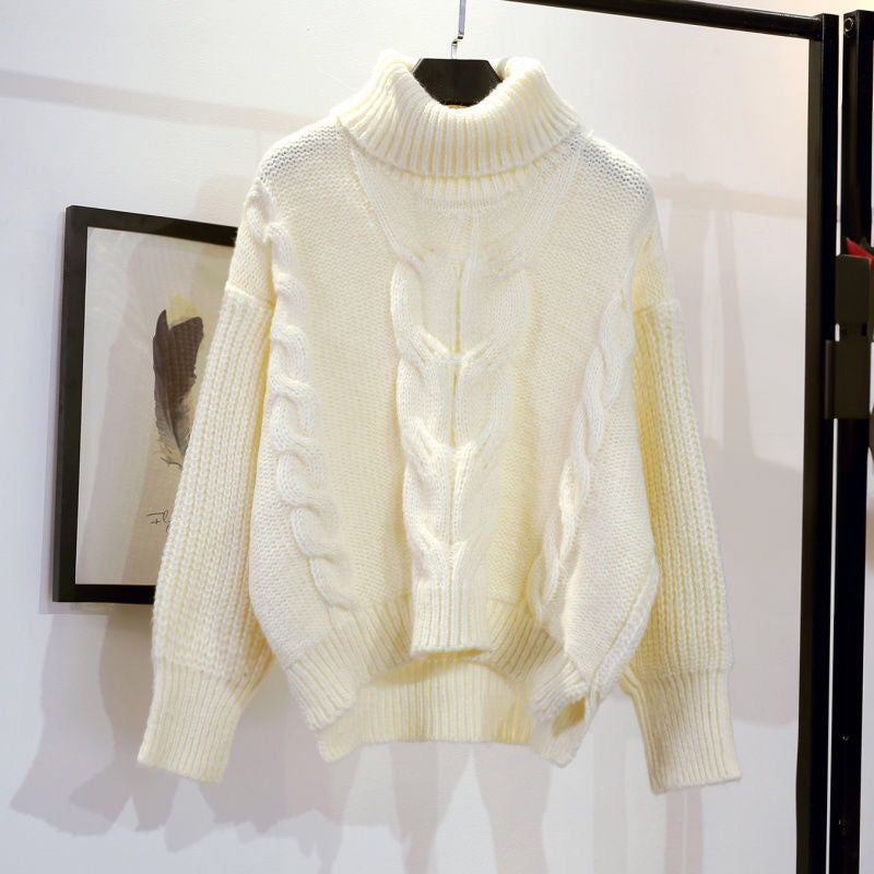 Women's knit pullover with high collar and loose fit