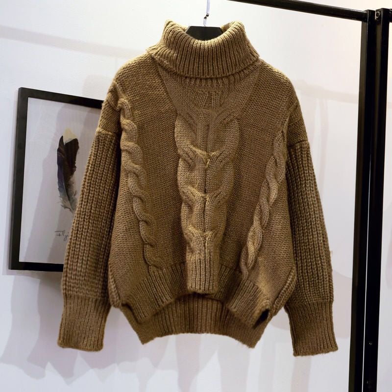 Women's knit pullover with high collar and loose fit