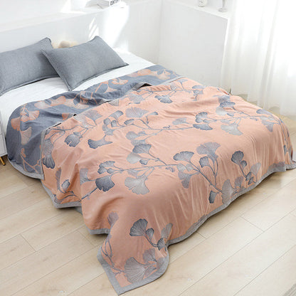 Reversible cotton gauze blanket with ginkgo leaf pattern and border, breathable for summer and transitional seasons