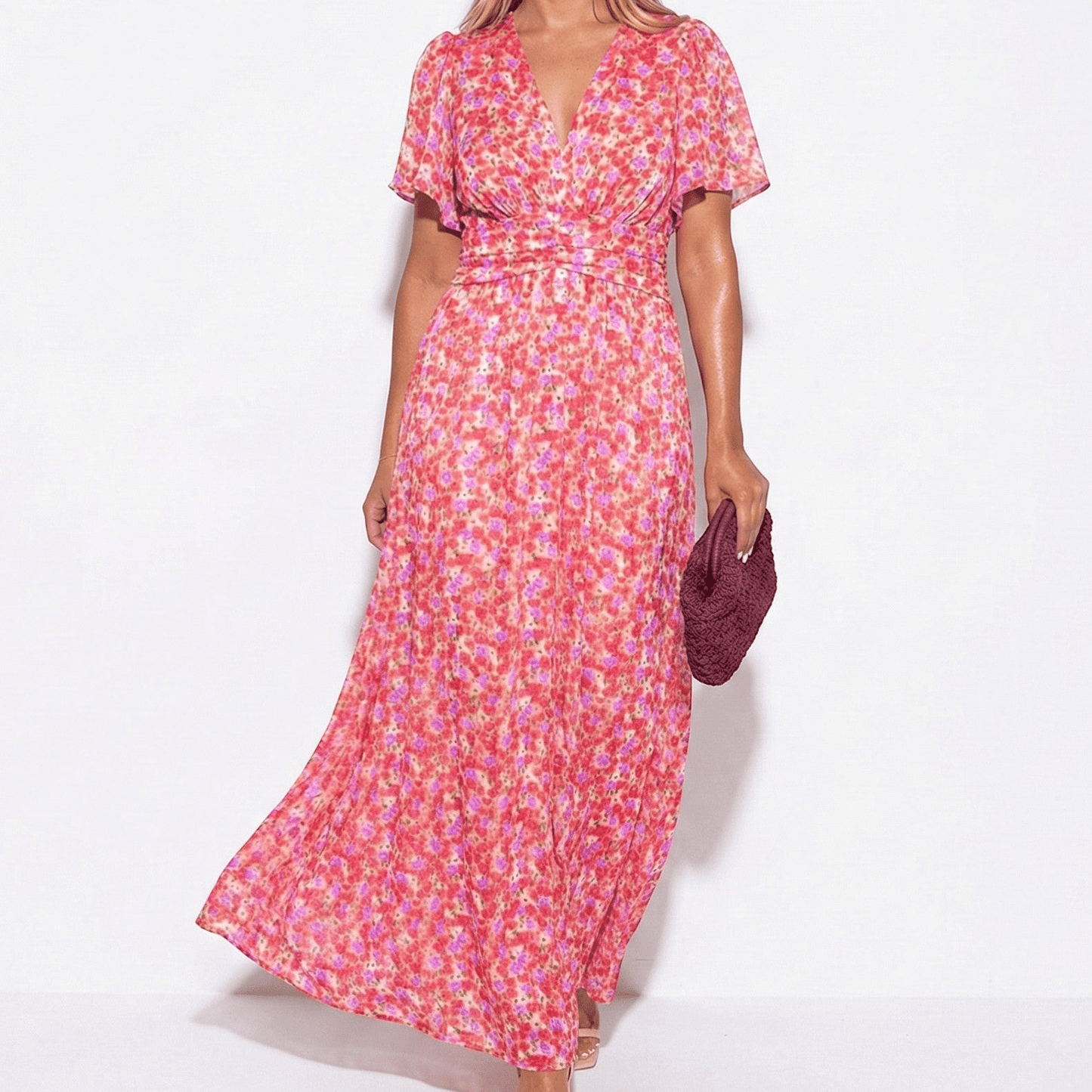 Women's maxi dress with V-neck, floral pattern, and flutter sleeves