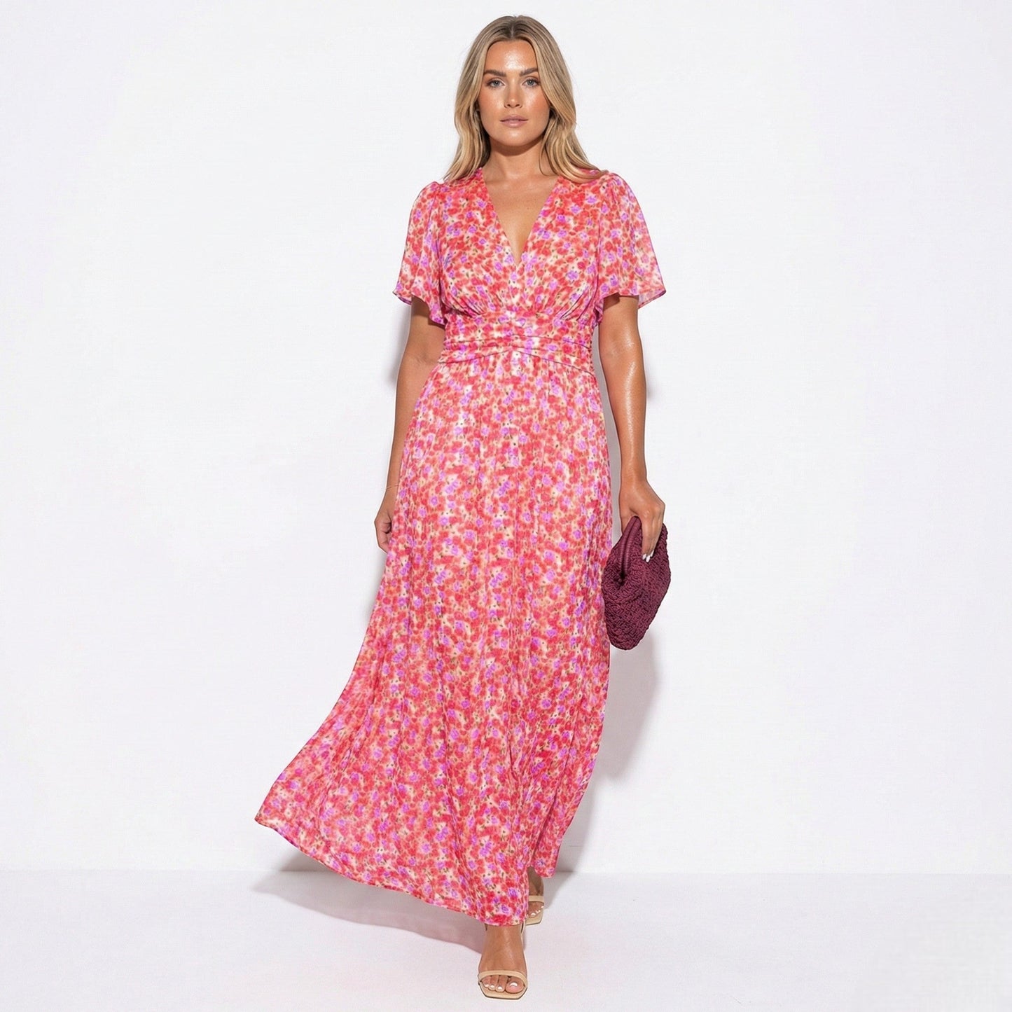 Women's maxi dress with V-neck, floral pattern, and flutter sleeves