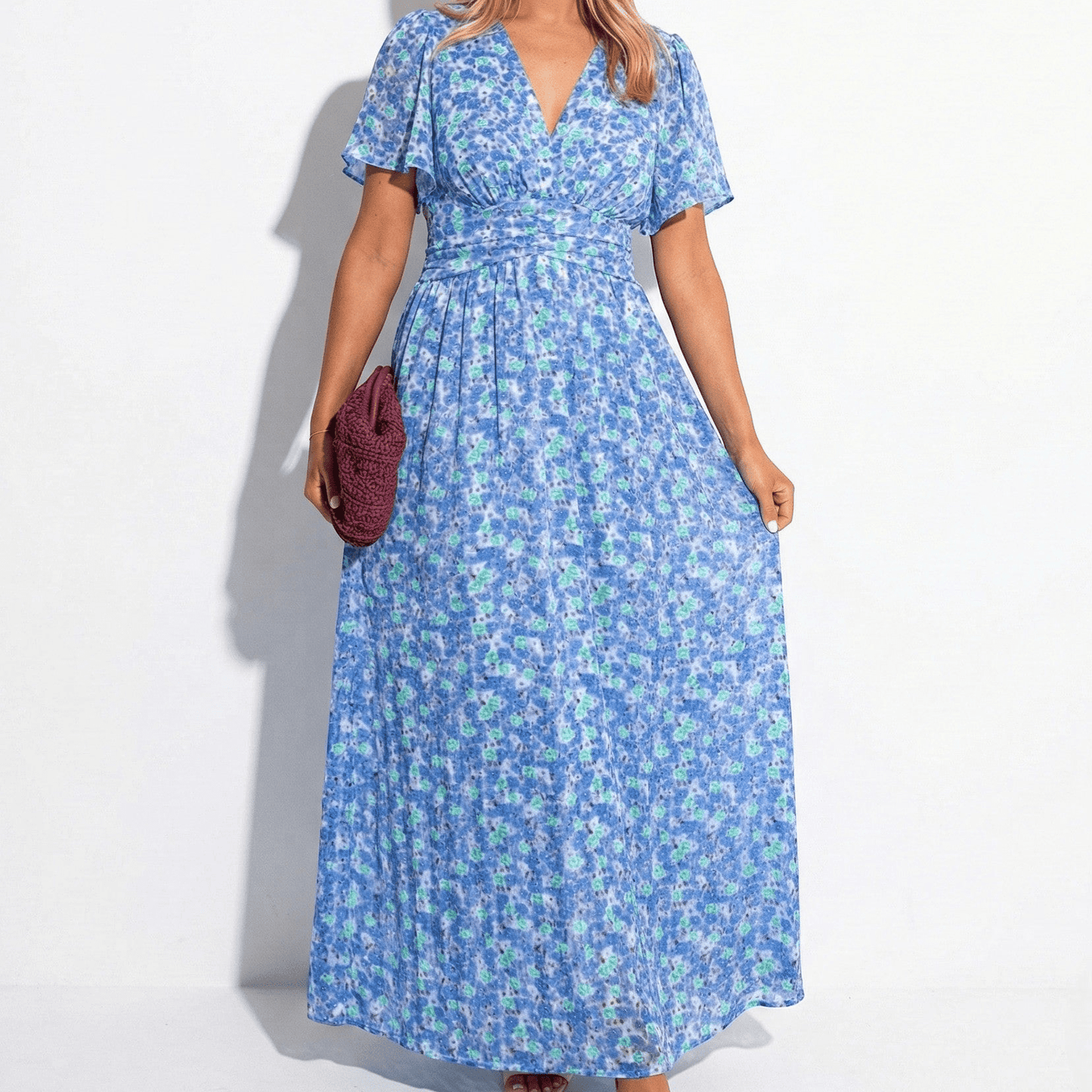 Women's maxi dress with V-neck, floral pattern, and flutter sleeves