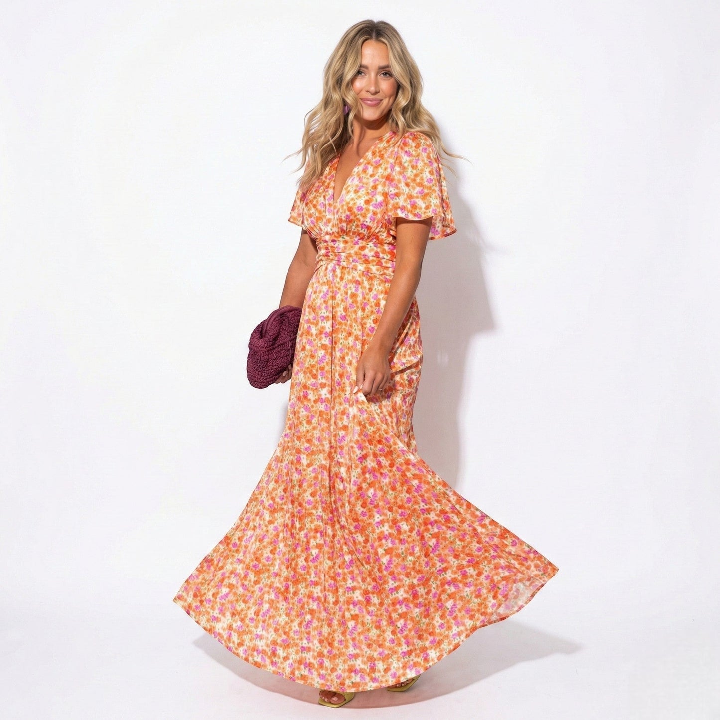 Women's maxi dress with V-neck, floral pattern, and flutter sleeves