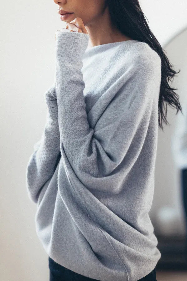 Women's sweater with asymmetrical collar and loose fit