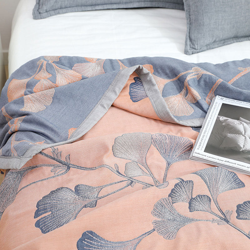 Reversible cotton gauze blanket with ginkgo leaf pattern and border, breathable for summer and transitional seasons