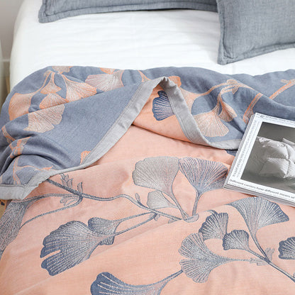 Reversible cotton gauze blanket with ginkgo leaf pattern and border, breathable for summer and transitional seasons