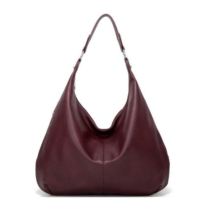 Women's handbag with classic shape and interior pockets